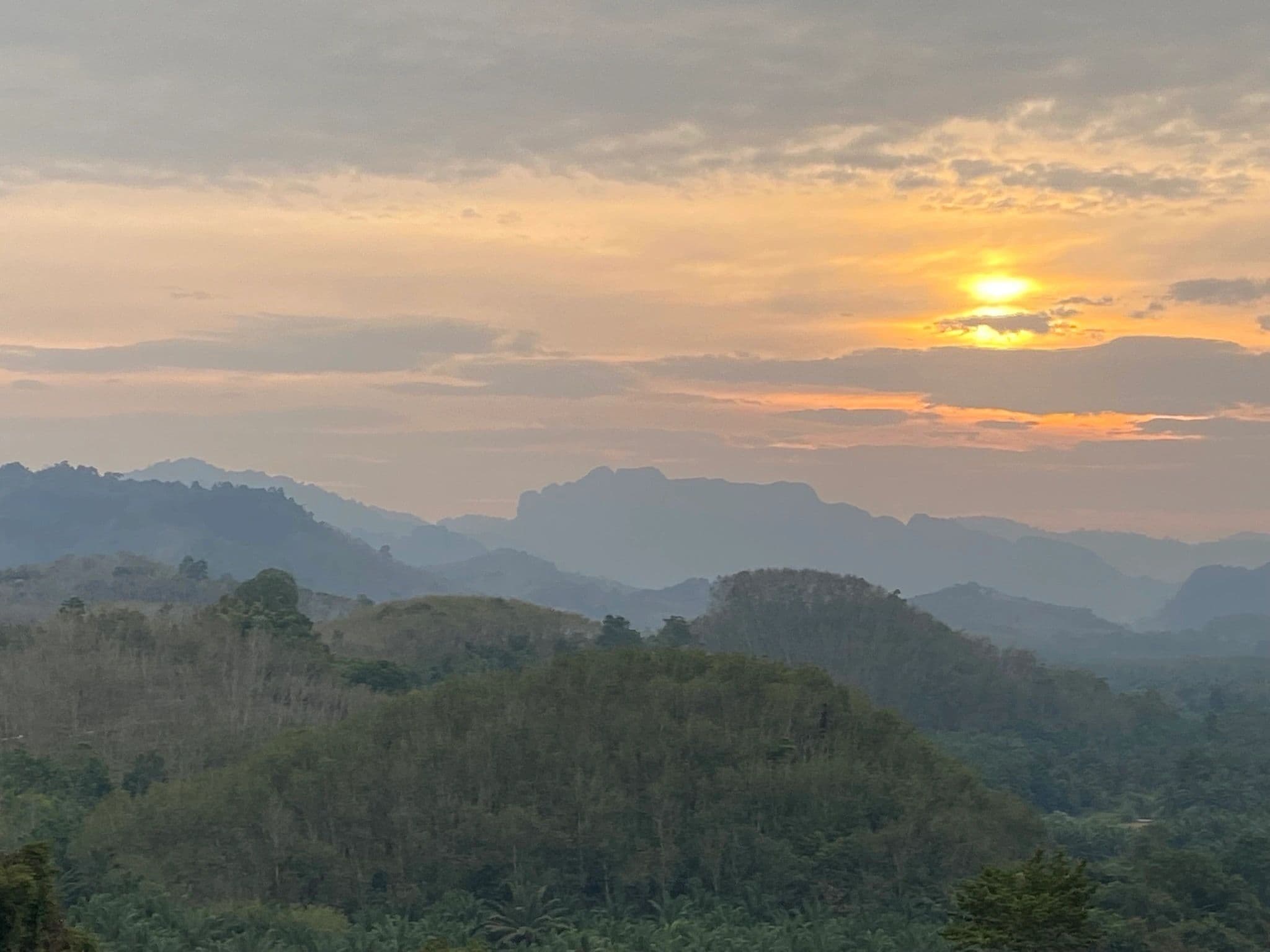 Golden sunset over tropical mountains